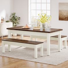 a dining table with two benches in front of it