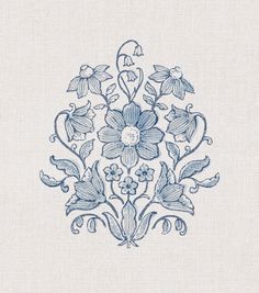 a blue and white embroidered design with flowers