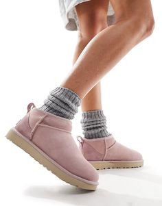 Slippers by UGG Good things come in pairs Pull tab for easy entry Signature UGG branding Round toe Treadlite by UGG™ outsole Textured tread Uggs Ultra Mini, Pink Ugg Slippers, Classic Boots Woman, Pink Suede Boots, Ultra Mini Boots, Pink Ugg Boots, Ugg Ultra Mini, Mini Boots, Pink Uggs