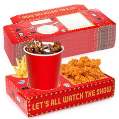 a red box filled with fries next to a bucket of chicken