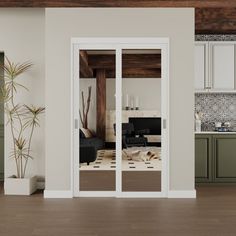 an open kitchen and living room with sliding glass doors