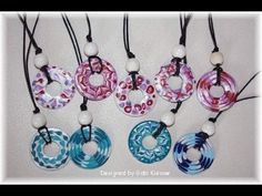 six necklaces with different designs on them