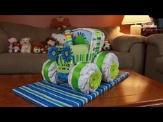 a baby carriage made out of diapers sitting on top of a table