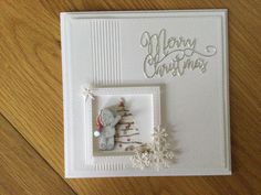 a christmas card with an elephant and snowflakes