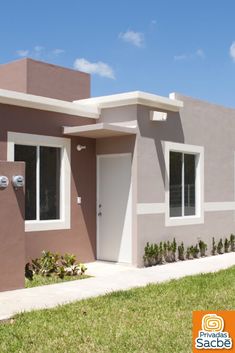 a house that is in the grass with a door and windows on each side of it