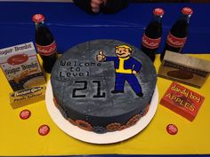 a birthday cake is decorated with an image of a man holding a beer and giving the thumbs up