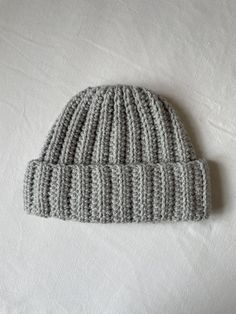 This cosy handmade crochet beanie is perfect for your little ones autumn wardrobe. I always recommend measuring a garment you already have & like the size of, and compare it to the measurements of my garment. Approx measurements of this cardigan: Length - 7.5 inches Width - 9 inches Gray Crochet Beanie Hat, Warm Gray Crochet Beanie Hat, Gray Soft Knit Crochet Beanie, Warm Gray Crochet Beanie, Gray Crochet Yarn Hat For Winter, Handmade Gray Crochet Hat, One Size, Winter Gray Crochet Hat Made Of Yarn, Gray Winter Crochet Hat Made Of Yarn, Handmade Gray Crochet Hat One Size