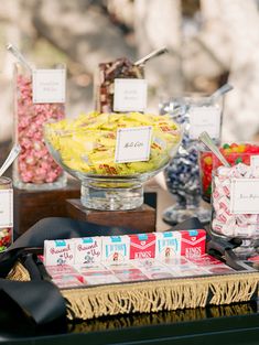 an assortment of candy and candies displayed on a table