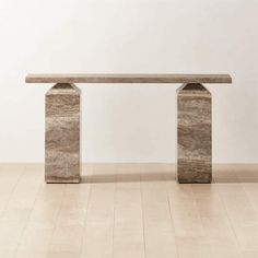 a stone bench sitting on top of a hard wood floor