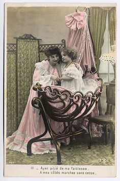 an old fashion photo of two women sitting on a bench in front of a mirror