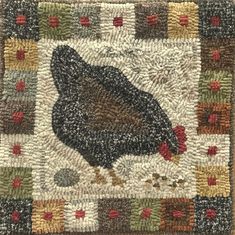 a close up of a rug with a chicken on it's back and an image of a bird in the middle