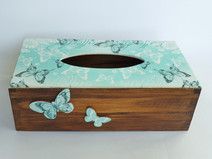 a tissue box with butterflies painted on it