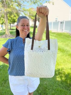 Every gal needs a lightweight, small Summer-vibe handbag! Just a dainty little thing that you can take with you on your minimalist getaway! This handbag will fit all your essentials and pair perfectly with all your stylish vacation or Summer outfits! Crochet Lace Shoulder Tote Bag available in Beige or White Bag Dimensions: 12" H x 5" W x 11" L 2 Straps: 23" each end to end Strap Drop: 9" Magnetic Snap Closure White Bags With Adjustable Strap For Everyday Use, Chic Bags With Leather Handles For Day Out, Chic Leather-handled Beach Bag For Everyday Use, Tote Shoulder Bag For Day Out, Summer Pouch Bag For Everyday Use, White Bags With Adjustable Handle For Everyday Use, Cream Beach Bag For Travel, Summer Bucket Bag With Removable Pouch For Day Out, Shoulder Bag With Leather Handles For Day Out