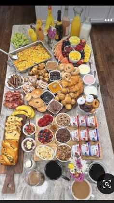 a table filled with lots of food and drinks