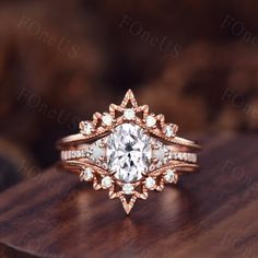 a diamond ring on top of a wooden table