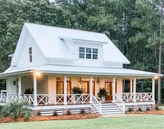 a large white house with porches and windows