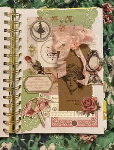 an open notebook covered in lots of different things