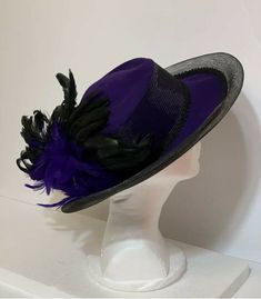 STUNNING VINTAGE Ellie  PURPLE HAT with BLACK FEATHERS 100% Wool Condition: EXCELLENT Classic Black Hat For Costume, Vintage Black Hat For Spring, Vintage Black Costume Hats For Spring, Vintage Black Costume Hat With Flat Brim, Vintage Fedora One Size Fits Most, Vintage Black Flat Brim Costume Hat, Vintage Short Brim Mini Hat For Costume, Vintage Short Brim Mini Hat For Costumes, Vintage Purple Hat With Short Brim