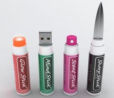 four different colored lipstick shaped usb devices next to each other