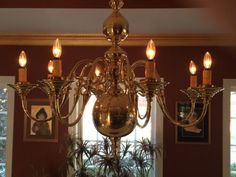 a chandelier hanging from the ceiling in a room