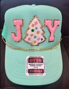 This mint green trucker hat is perfect for the holiday season, with chenille patches, spelling JOY. The patches have been pressed with a commercial hat press, ensuring adhesion. You also have the option to add on a hat chain, making this hat extra cute this season. BONUS, the chain is detachable, and you can actually use it on any other trucker hat. 🙌🏼 Check out all the pictures for various chain options. Trucker Hats With Patches, Green Trucker Hat, Hat Chain, Funny Trucker Hat, Bar Business, Hat Bar, Chenille Patches, Custom Trucker Hats, Painted Hats