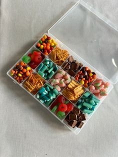 a plastic container filled with lots of candy