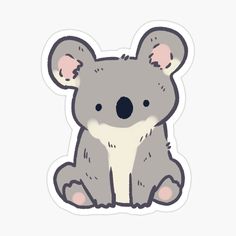 a koala sticker sitting on the ground