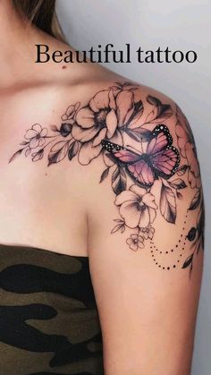 a woman with a butterfly tattoo on her shoulder and chest is looking at the camera