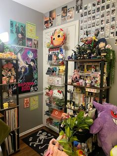 a living room filled with lots of toys and decor on the walls, including bookshelves