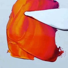 an orange and red painting with white paint