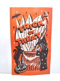 an orange and black poster with words trick or treat written on the front in white