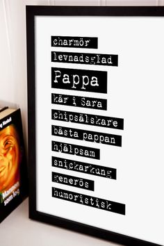 a black and white framed poster with the words papa on it next to a book