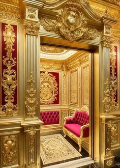 an ornately decorated room with red and gold accents, including a pink velvet chair