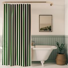 a bathroom with green and black striped shower curtain next to a bathtub in the corner