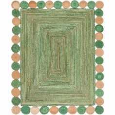 a green rug with pom poms on the bottom and an oval design in the middle