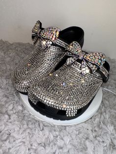 MyStyleMyWay's  custom crocs are designed for the perfect outfit, that special occasion, and "Just Because" you love blinged out crocs.  In the display shown we designed a pair of black  classic crocs adding high quality colorful rhinestones. 🎀 Each Rhinestone is individually and neatly placed to achieve the design.  🎀Rhinestones are added to the top portion of the shoe 🎀Bows are applied to the sports mode strap to this design to add cuteness and personality.  🎀This design do not have charms, charms can be added please contact us directly or visit our website www.MyStyleMyWay.co to view our charm selection.  🎀When making your purchase - You're making a purchase for the exact style shown. If you would like a different color rhinestone,  and or different charms please message us so we c Delta Sigma Theta Bling Crocs, Bling Crocs Shoes Blue, Customized Crocs Shoes, Blinged Out Crocs, Blinged Crocs, Bedazzled Crocs, Croc Ideas, Shoe Bows, Bling Crocs