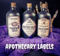 three bottles of pumpkin juice sitting on top of a purple blanket with the words apothecary labels