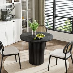 a kitchen table with chairs around it and fruit on the plate in front of them