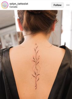 a woman with a tattoo on her back