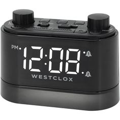 the alarm clock is black and has white numbers