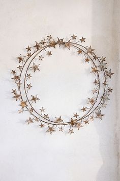 a metal star wreath hanging on the wall