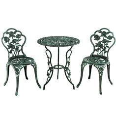 an iron table and two chairs with flowers on them