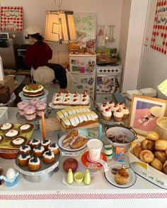 a table filled with lots of pastries and desserts