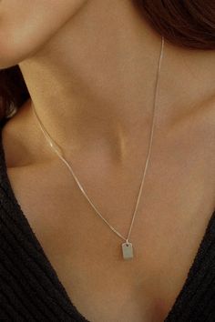 Our beautiful Diamond Cut Necklace is a true testament to refined simplicity. Crafted with meticulous attention to detail, this necklace features a dainty chain and delicate pendant, creating a graceful and understated design that effortlessly enhances your natural beauty. 935 Sterling Silver Width - 1.2mm  Tag Size - 6x13mm Extender - 1 inch If you would like a custom length, please don't hesitate to ask. We are more than happy to make one for you. All items come packaged in a gift box ready to give as a gift or keep for yourself. 925 Sterling silver is composed of 92.5% pure silver and 7.5% copper. Sterling silver is a popular choice for jewellery enthusiasts and designers due to its versatility, affordability, and classic beauty. It offers a timeless elegance that complements various st Diamond Cut Necklace, Delicate Pendant, Minimal Necklace, Stacked Necklaces, Necklace Layering, Dainty Chain, Ball Pendant, Necklace Charm, Layered Bracelets