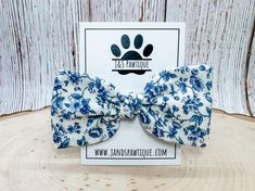 This floral knotted hair bow clip is the PAWfect touch for any occasion!  Our hair bow clips are made with 100% cotton fabric and attached to an alligator clip. They also have the option to add trim on the sides for extra flare in either a black, white or cream color trim. They are made for dogs or humans.  Matching Bandana (sold separately):  🐾 Sizing 🐾 Approximately 1.5" in length by 3.5" across.  Each hair clip is handmade with love so patterns may vary slightly due to the cut of fabric or slight variations in sizes. 🐾 Processing time is 2 to 4 business days in addition to shipping time. Free USPS First-Class Mail shipping on orders over $50.00.  🐾 Care Instructions 🐾 Hand wash in cold water and lay flat to air dry.  🐾 With your ideas and our creativity, we can partner together to Dog Hair Bow, Hair Bow Clips, Flower Hair Bows, Toddler Bow, Flower Dog, Dog Hair Bows, Hair Bow Clip, Toddler Bows, Girl Dog