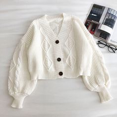 Cropped cardigan with cable knitting. Layer it up with some turtlenecks! Fits S-M 25" across shoulders 44" chest 17" length Cropped Cardigan Outfit, White Cardigan Outfit, Crochet Sweater Design, Loose Coat, Pullover Mode, Fashion Top Outfits, Cable Knitting, Loose Coats, Button Sweater