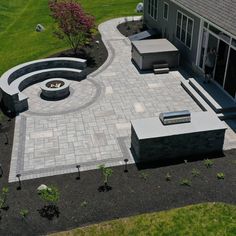 an aerial view of a patio and fire pit