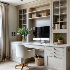 a white desk with a computer on top of it