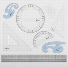 an image of various shapes and sizes on a sheet of paper with rulers, rulers, and circles