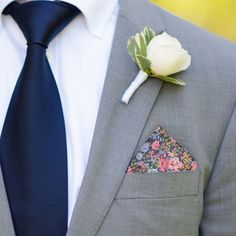 A striking floral design in cornflower blue, pink, green and orange on indigo blue. A great pop of colour to traditional suit colours, and works well with either white, pale blue or pale pink shirts. Pre-folded styles are sewn into a cardboard sleeve for convenience and consistency. For an unfolded pocket square, a handkerchief is also available. Made in Britain. Made with 100% Polyester Satin. Pocket Square Folds, Pink Pocket Square, Green Pocket Square, Smart Attire, White Pocket Square, Grey Suit Jacket, Grey Wedding